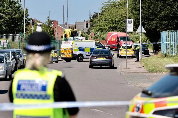 Police at the scene of the stabbing incident on Edge Lane, Droylsden