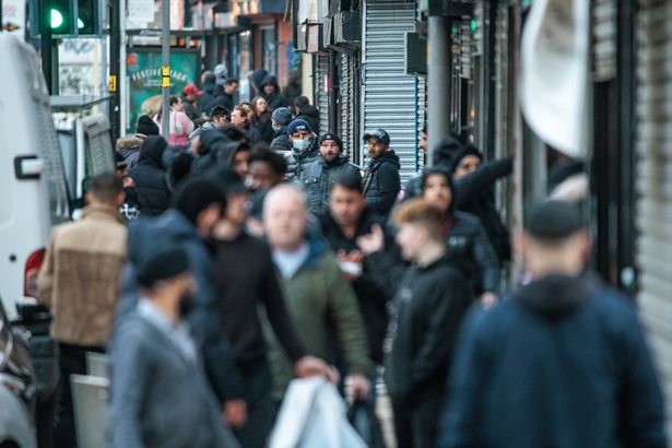 A busy Bury New Road before the crackdown on counterfeit shops