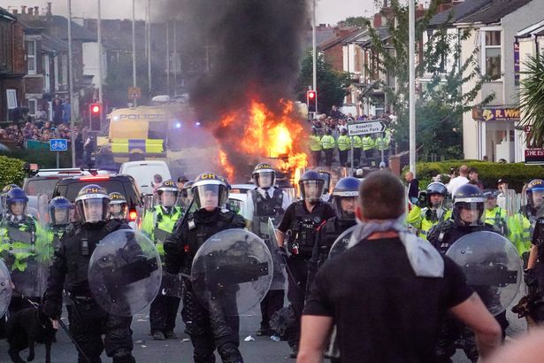Police under attack during Southport riots