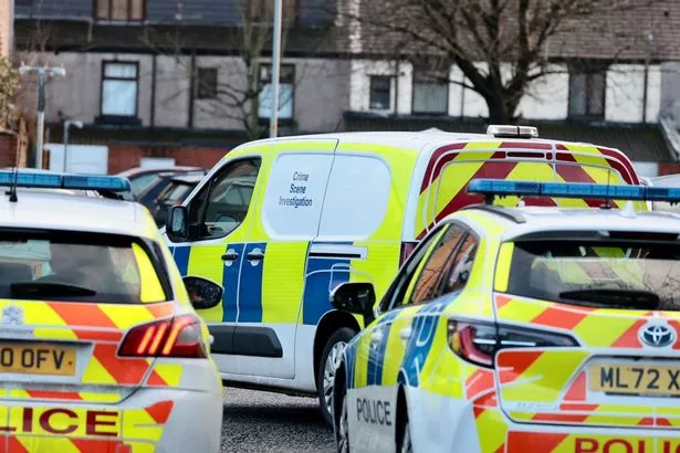 Police at the scene on New Year's Day
