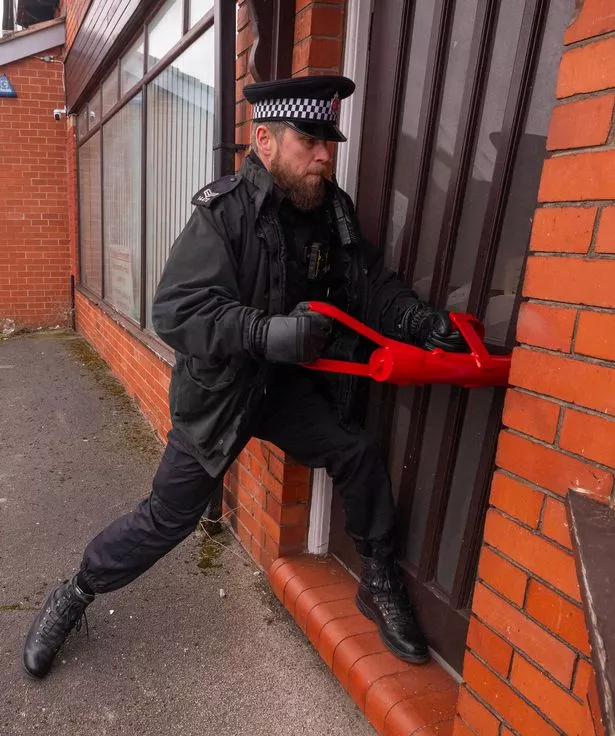 Greater Manchester Police breach a cannabis farm property